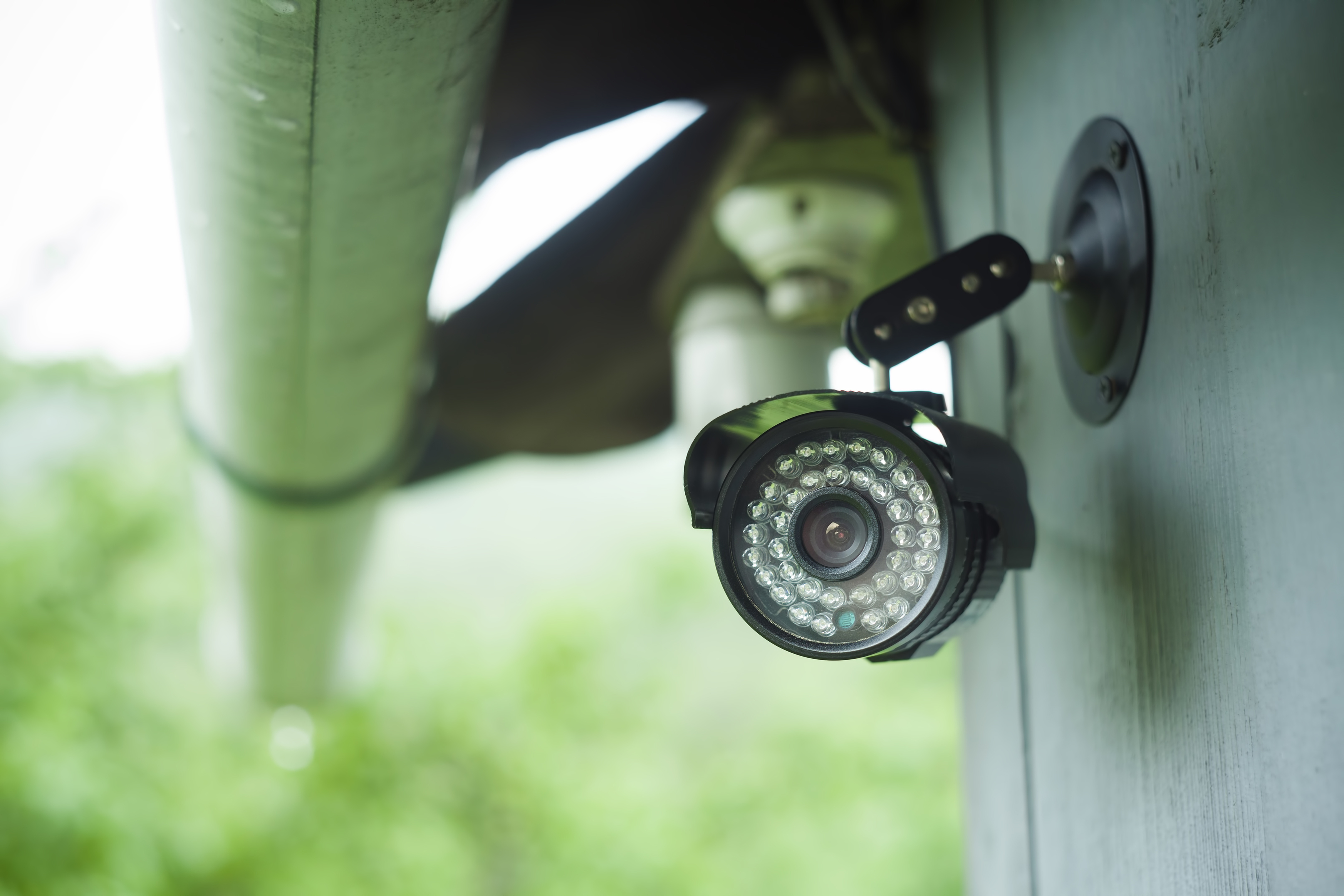 A surveillance camera mounted on the exterior of a building