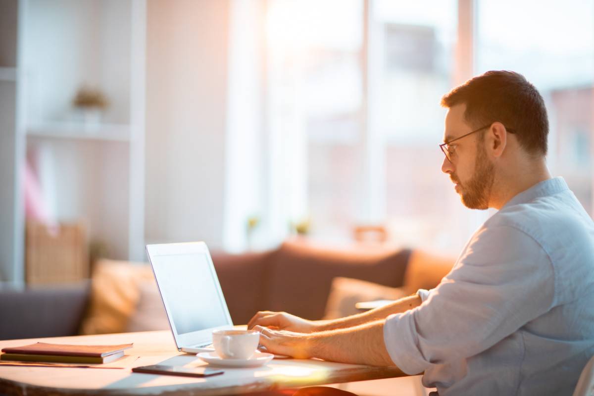 A man working from home using his laptop