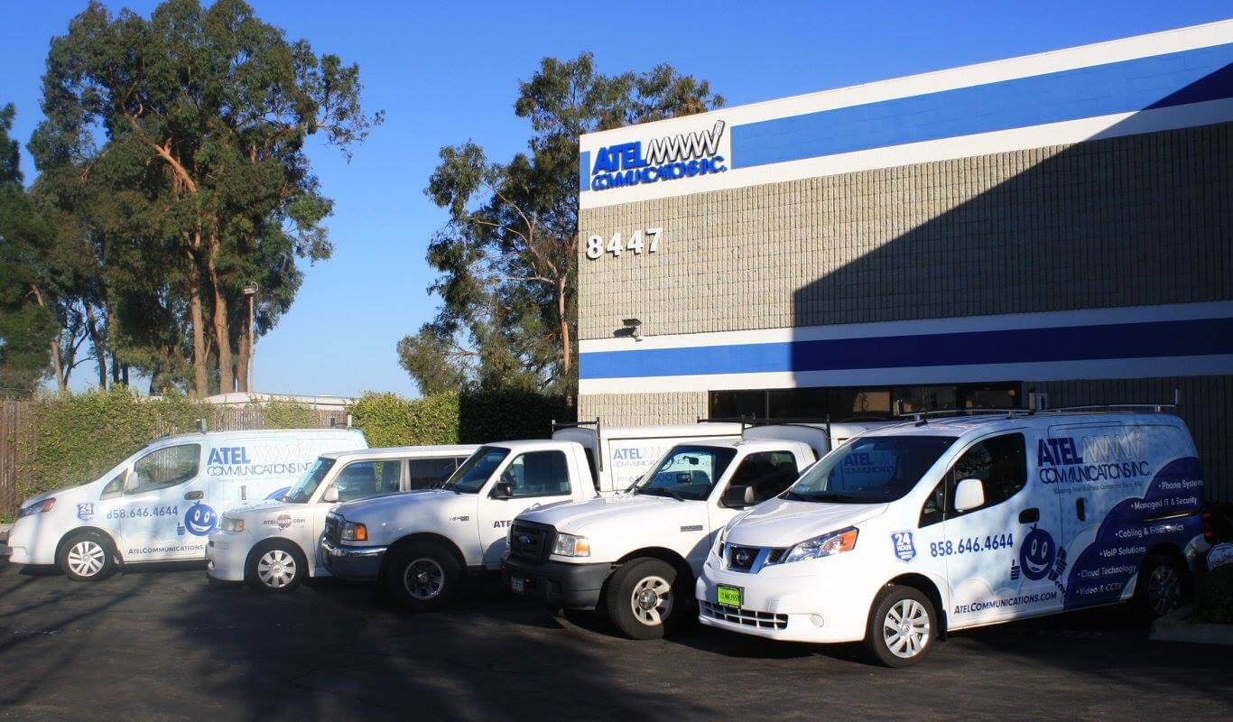 ATEL Technologies, Inc. trucks lined up outside the office