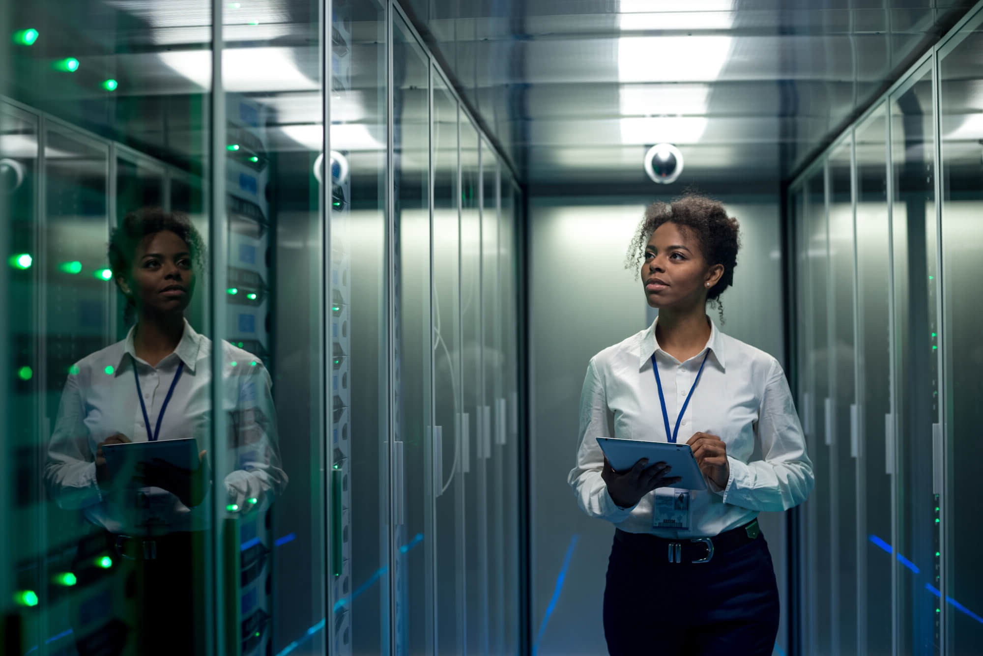 A women waling through a server room