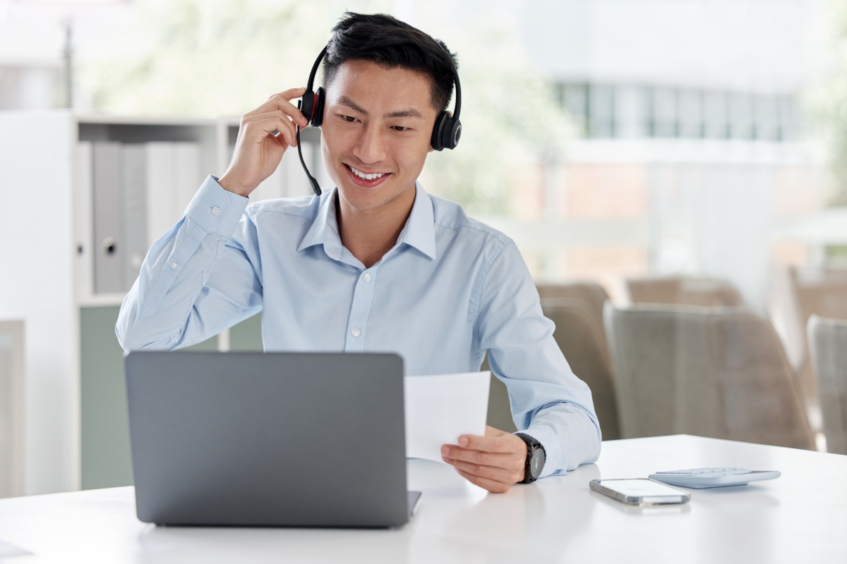 A help desk worker sitting at his desk